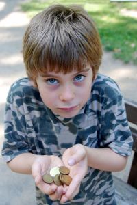 1064376_sad_boy_with_the_coins.jpg